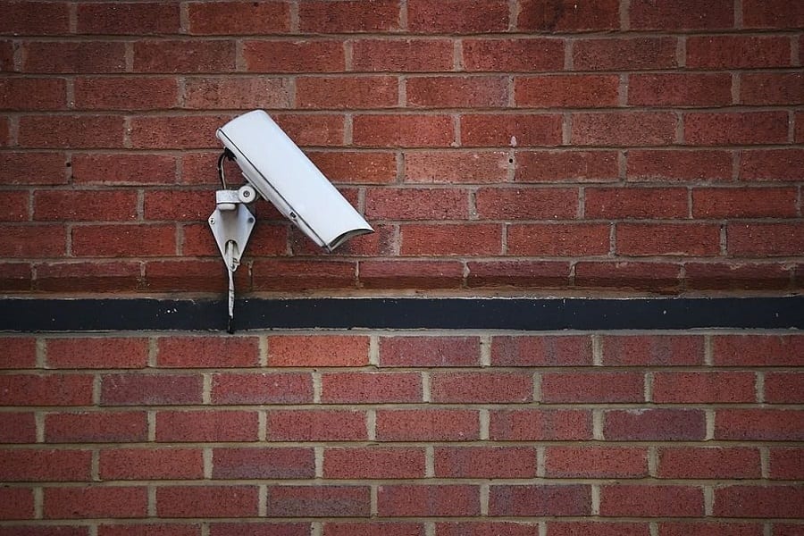 fake camera on brick wall